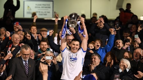 Conor Prunty lifts the Division cup