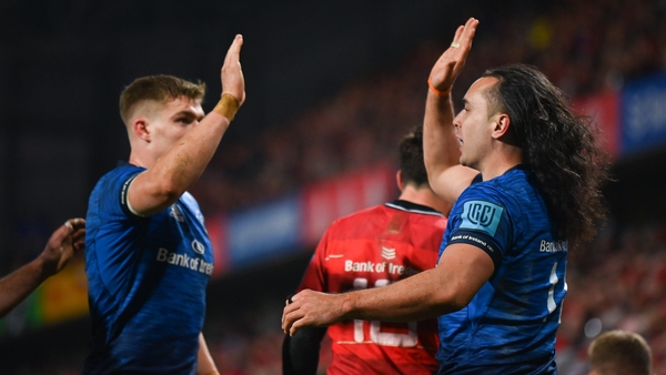 James Lowe (right) celebrates his second, and Leinster's fourth try against Munster
