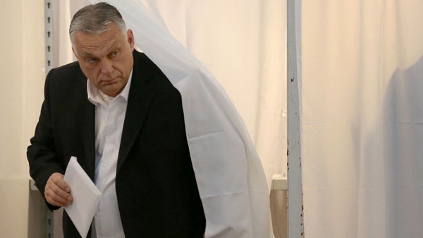 Viktor Orban prepares to cast his ballot during the elections at a polling station in Budapest