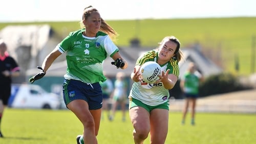 Becky Bryant of Offaly in action against Cathy Mee of Limerick