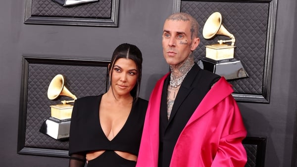 Kourtney Kardashian with husband Travis Barker at the 2022 Grammys.