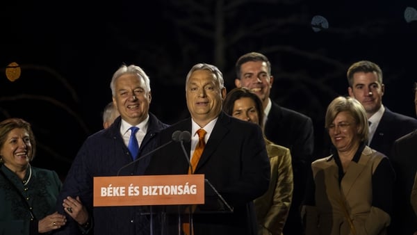 Hungarian Prime Minister Viktor Orban celebrates on stage with members of the Fidesz party