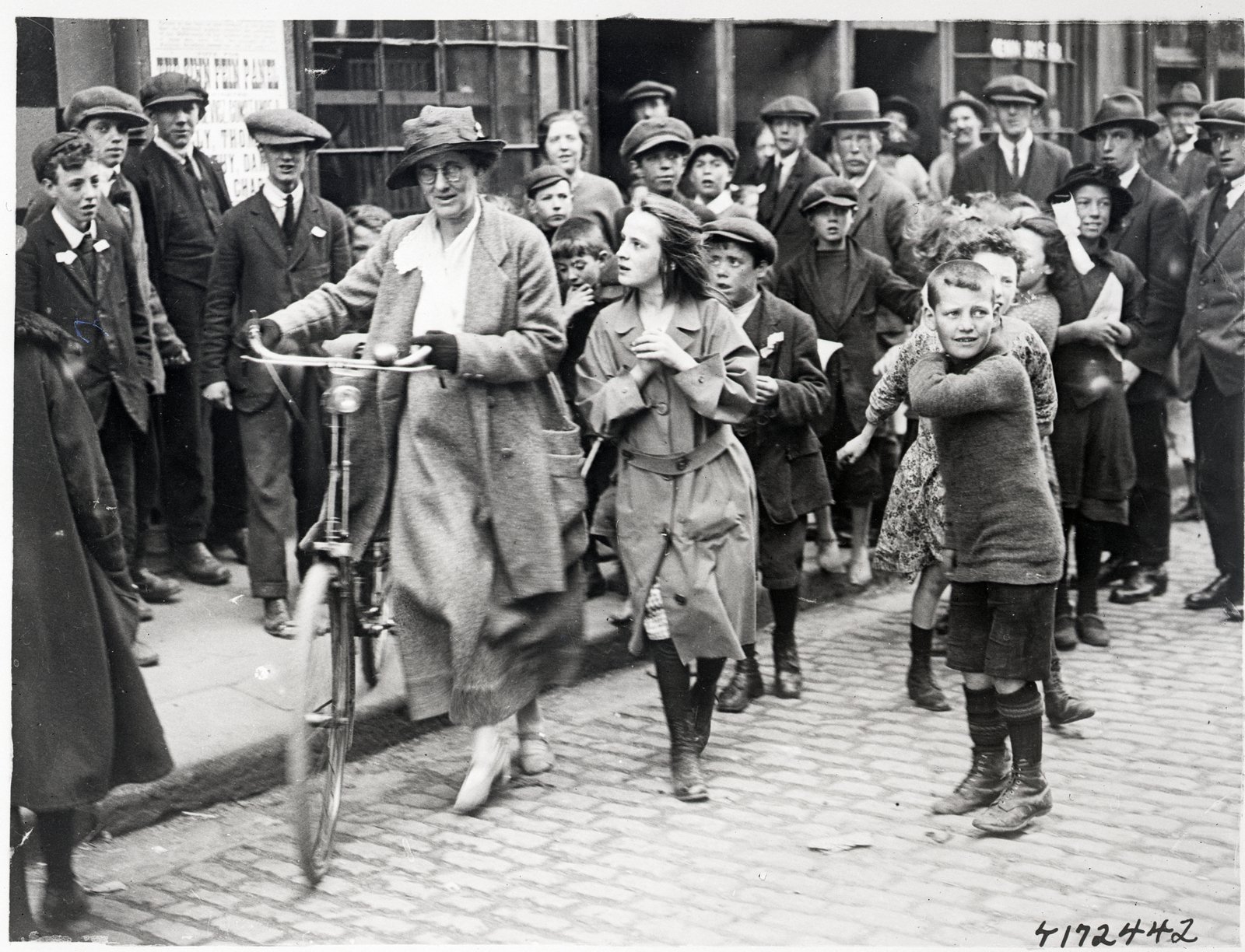 Image - Countess Markievicz toured polling stations on her bicycle - and attracted some curious young observers. Photo: Bettmann/Getty Images
