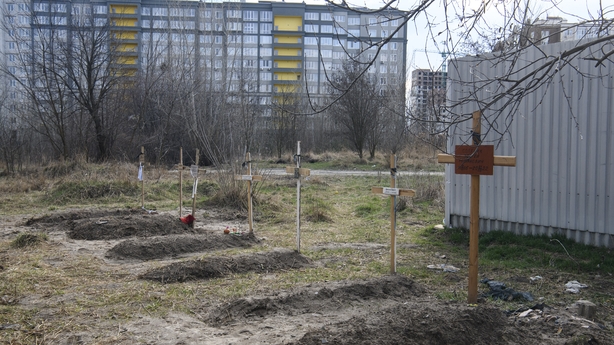 Civilian graves next to apartments blocks in the recaptured city of Bucha on 4 April 2022