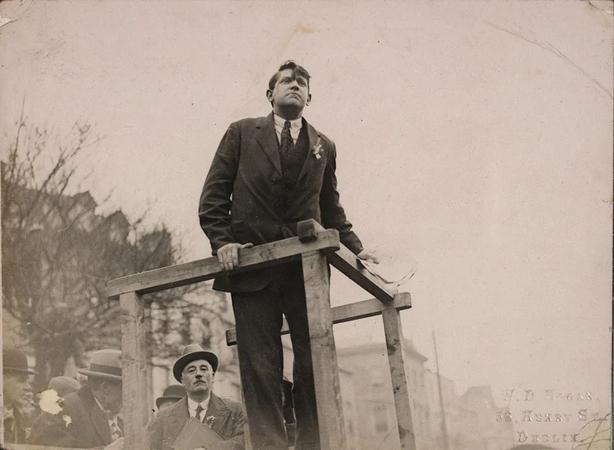 Century Ireland 228 - Michael Collins speaking from a podium Photo: National Library of Ireland