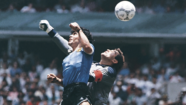 Maradona out-jumping England's goalkeeper Peter Shilton before scoring with his hand