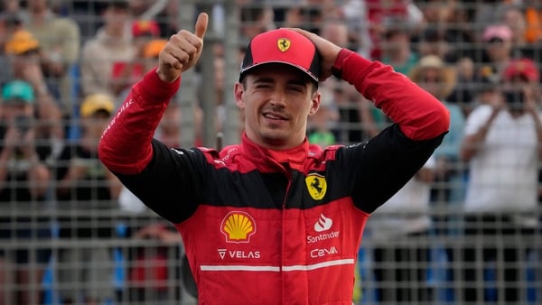 Charles Leclerc gestures after taking pole position