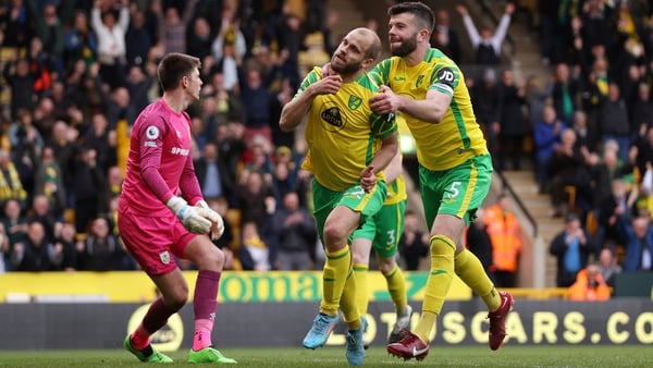 Teemu Pukki celebrates with Canaries team-mate Grant Hanley after scoring the late second goal