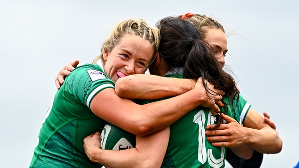 Ireland celebrate the opening try of the game from Lucy Mulhall