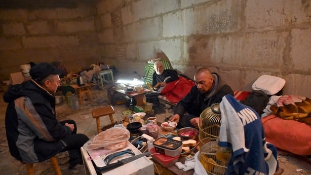 People in Kharkiv protect themselves from shellings in the basement of a multi-storey building