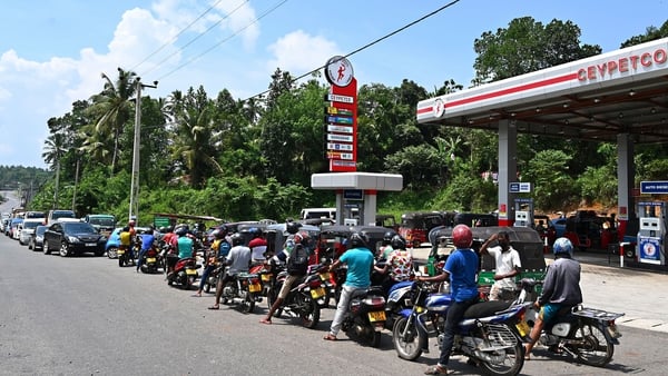 Motorists queue to buy petrol in Colombo