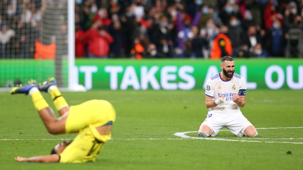 Real Madrid's Karim Benzema celebrates at the final as Reece James hits the floor in despair
