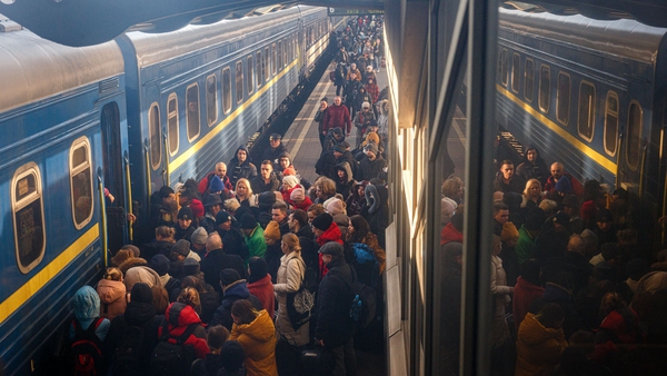 People board an evacuation train at Kyiv central train station on 28 February