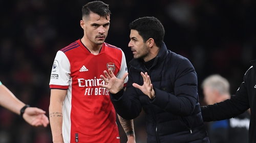 Granit Xhaka (L) credits manager Mikel Arteta with persuading him to stay at Arsenal