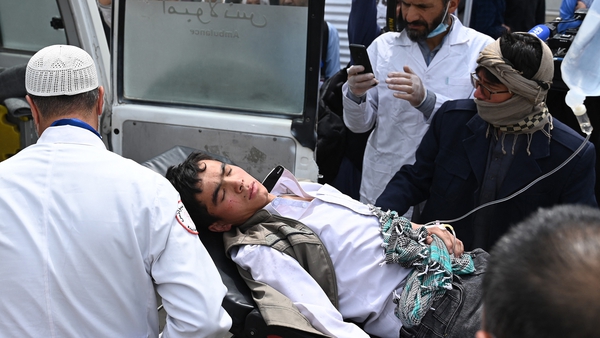 An injured student is taken from the scene of the blasts