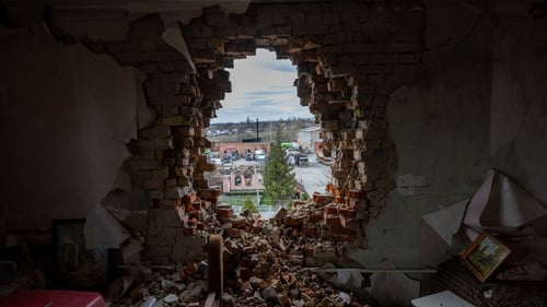 Debris lies in a war damaged apartment on 19 April in Makarov, Ukraine
