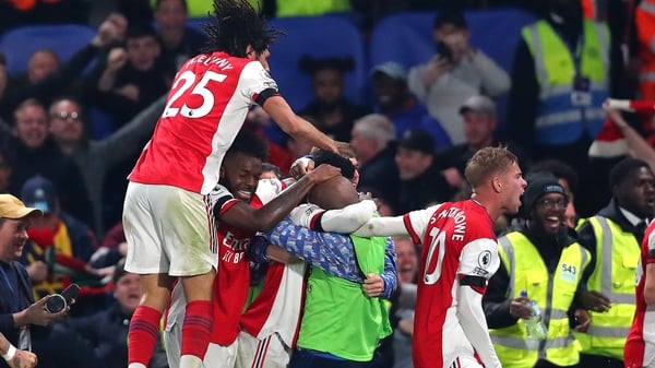 Eddie Nketiah is mobbed after scoring his team's third goal
