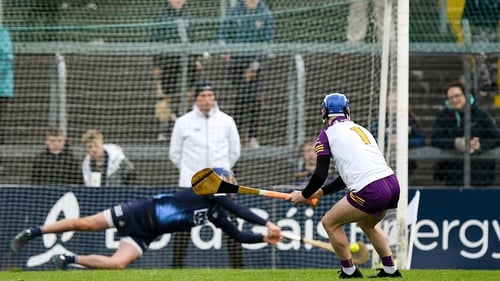 Dublin goalkeeper Seán Brennan gets down to save Mark Fanning's penalty