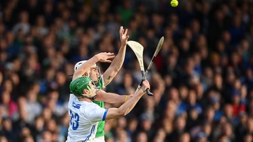 Limerick's Aaron Gillane and Tom Barron of Waterford compete for the ball