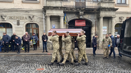 Ukrainian soldiers carry the coffin of their fallen comrade Oleg Kobyrn in Lviv