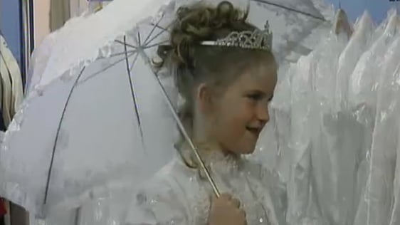 Katie Lee tries on her First Communion outfit, 2002.
