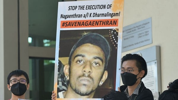 Protesters last month hold a picture of Nagaenthran Dharmalingam