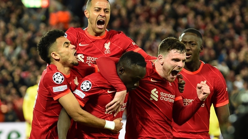 Sadio Mane is congratulated by his Liverpool team-mates after scoring their second goal
