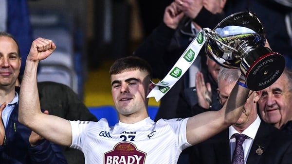 Kildare captain Aaron Browne lifts the cup
