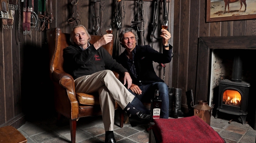 Henry and Alex Mountcharles raise a glass at Slane Distillery