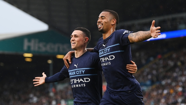 Gabriel Jesus (R) celebrates with Phil Foden after scoring Manchester City's third goal against Leeds