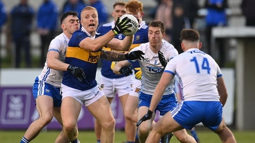 Teddy Doyle of Tipperary evades some would-be Waterford tacklers