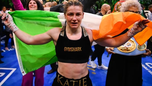 Katie Taylor celebrates inside the ring following the victory