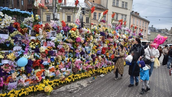 Every day the floral shrine in Lviv grows