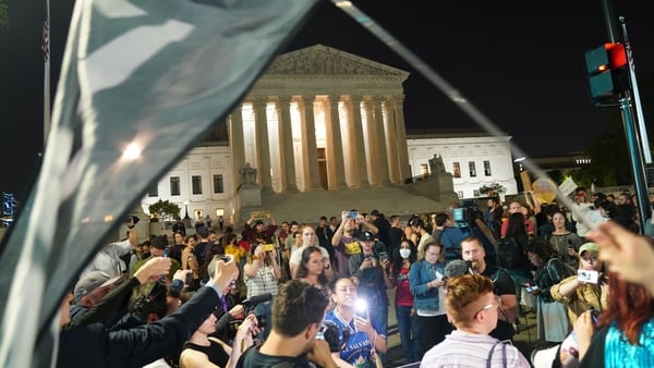 Activists gathered outside the US Supreme Court in Washington after news broke of the draft opinion