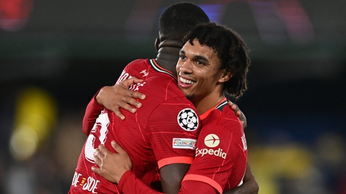 Trent Alexander-Arnold (R) embraces Ibrahima Konate at the final whistle