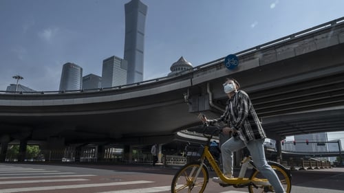 The Chinese capital's streets were slightly less hectic than on a normal working day, with some people taking to bicycles to get around