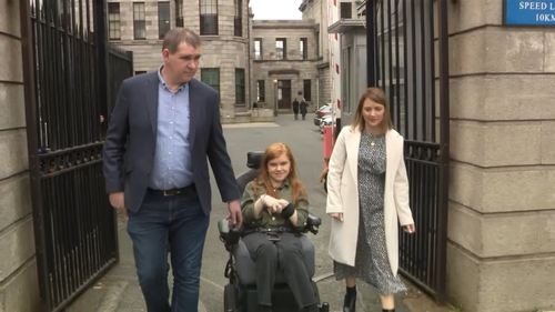 Ruby McCandless pictured with her parents outside court today