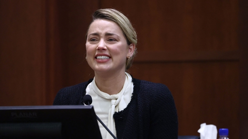 US actress Amber Heard testifies at the Fairfax County Circuit Courthouse in Fairfax, Virginia. (Photo by JIM LO SCALZO. AFP via Getty Images)