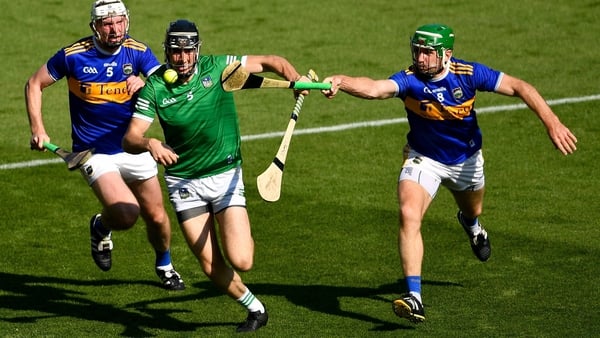 Limerick's Diarmaid Byrnes beingg pursued by Séamus Kennedy and Noel McGrath in the 2021 Munster final