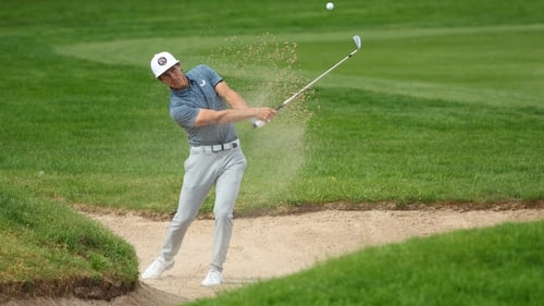 Thorbjorn Olesen of Denmark plays out of a bunker on 15