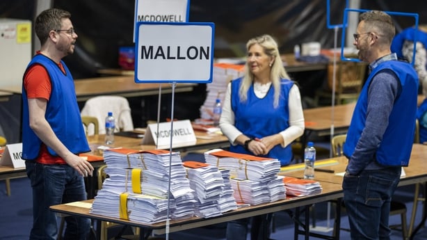 Talliers stand beside the ballots of SDLP Assembly candidate Nichola Mallon in Belfast