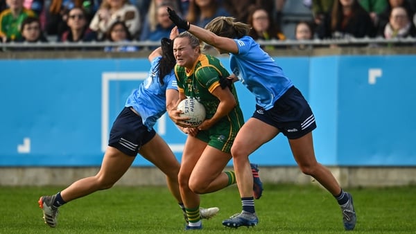 Meath's Vikki Wall (C) is tackled by Sinead Goldrick (L) and Kate McDaid