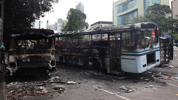 Burnt-out buses near Sri Lanka's former prime minister Mahinda Rajapaksa's official residence in Colombo