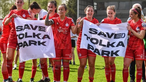 Shelbourne players celebrate with a "Saved Tolka Park" banner after beating Peamount United at the ground in the Women's National League last weekend