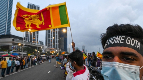 Anti-government demonstrators take part in a protest near the President's office in Colombo