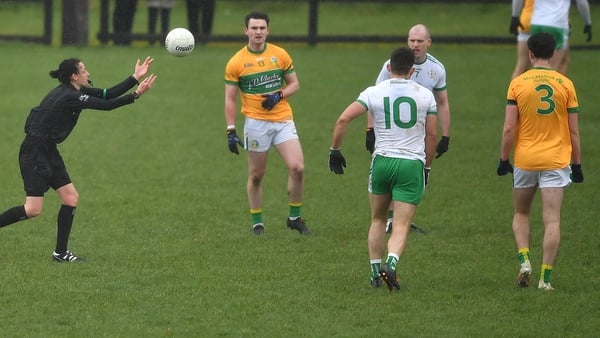Maggie Farrelly (L) throws the ball in for the league meeting of Leitrim and London