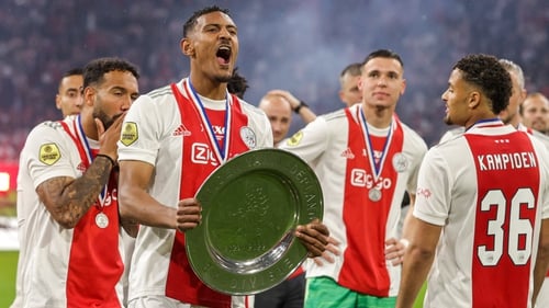 Sebastien Haller celebrates with the Eredivisie trophy