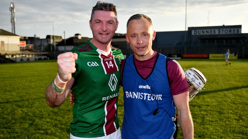 Derek McNicholas and manager Joe Fortune celebrate the draw against Wexford