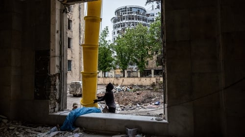 A worker removes debris from the ruins of the Kharkiv regional administration building today, after Ukraine drove Russia away from its second-largest city