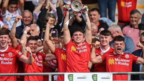 Tyrone captain Niall Devlin lifts the cup